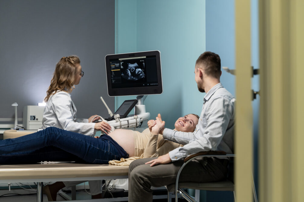 gynecologist performing ultrasound consultation
